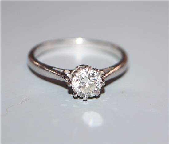 A platinum and solitaire diamond ring, size N.